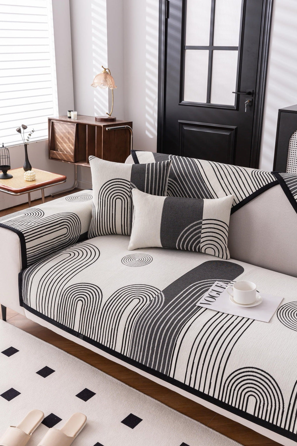 Sofa Decor Arcadia Arch Line Sofa Cover in Black Cream - styled sofa image for water resistant patterned couch covers in the UK