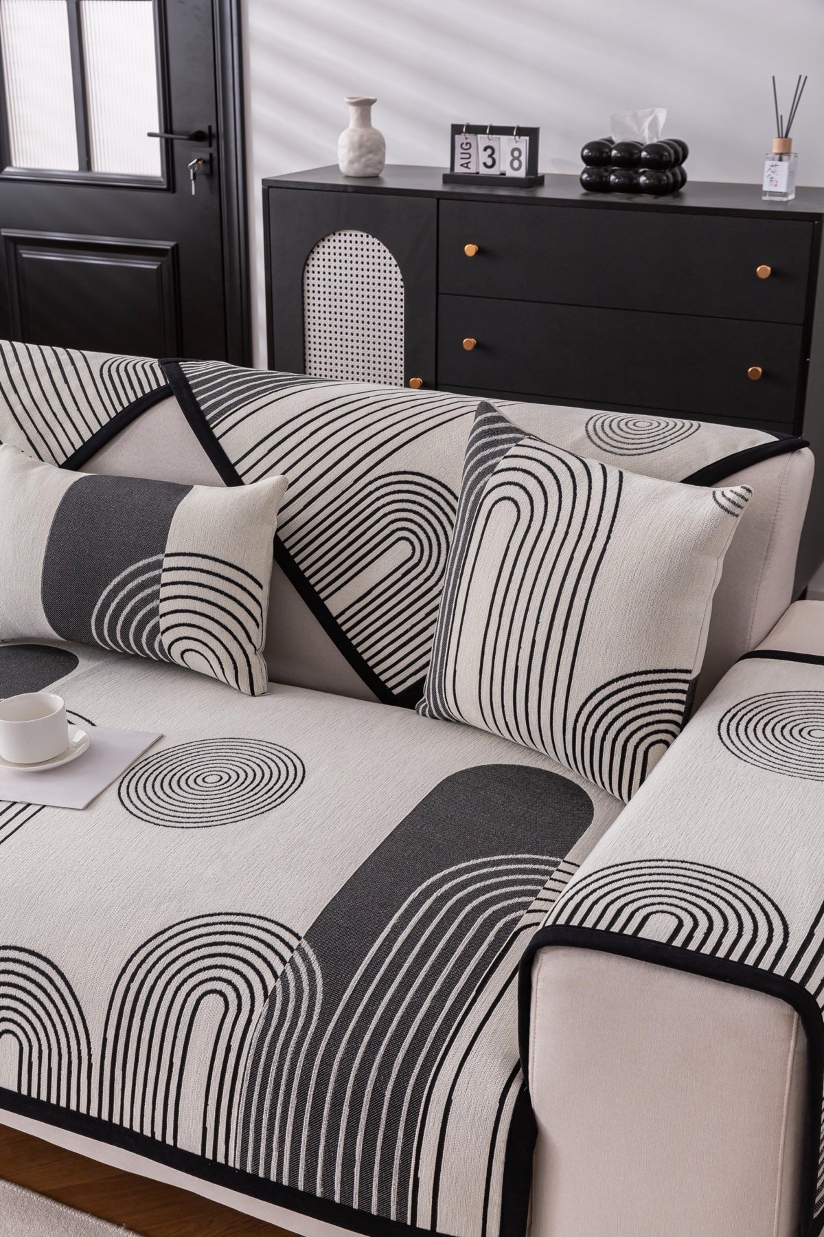 Sofa Decor Arcadia Arch Line Sofa Cover in Black Cream - styled sofa image for water resistant patterned couch covers in the UK