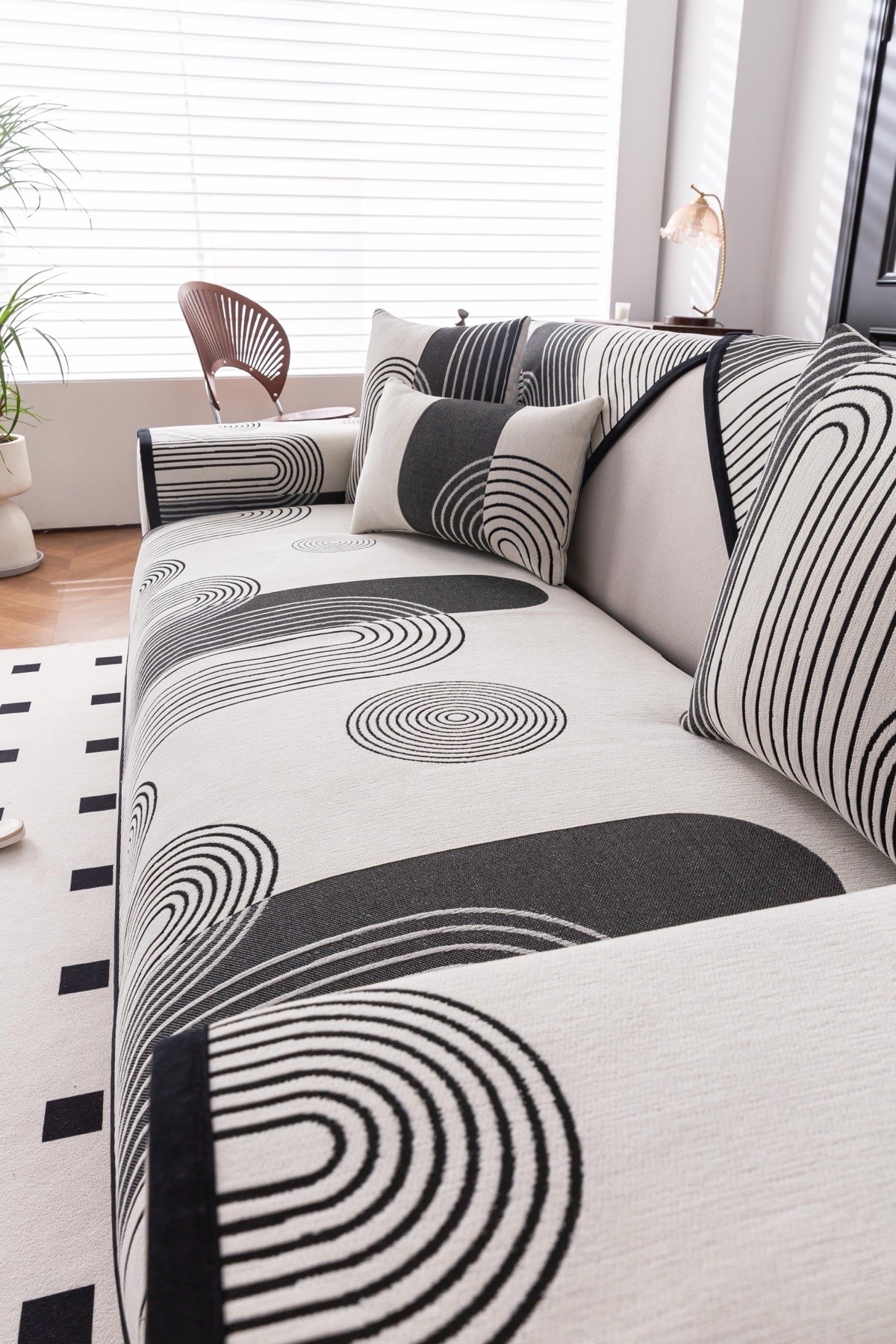 Sofa Decor Arcadia Arch Line Sofa Cover in Black Cream - styled sofa image for water resistant patterned couch covers in the UK