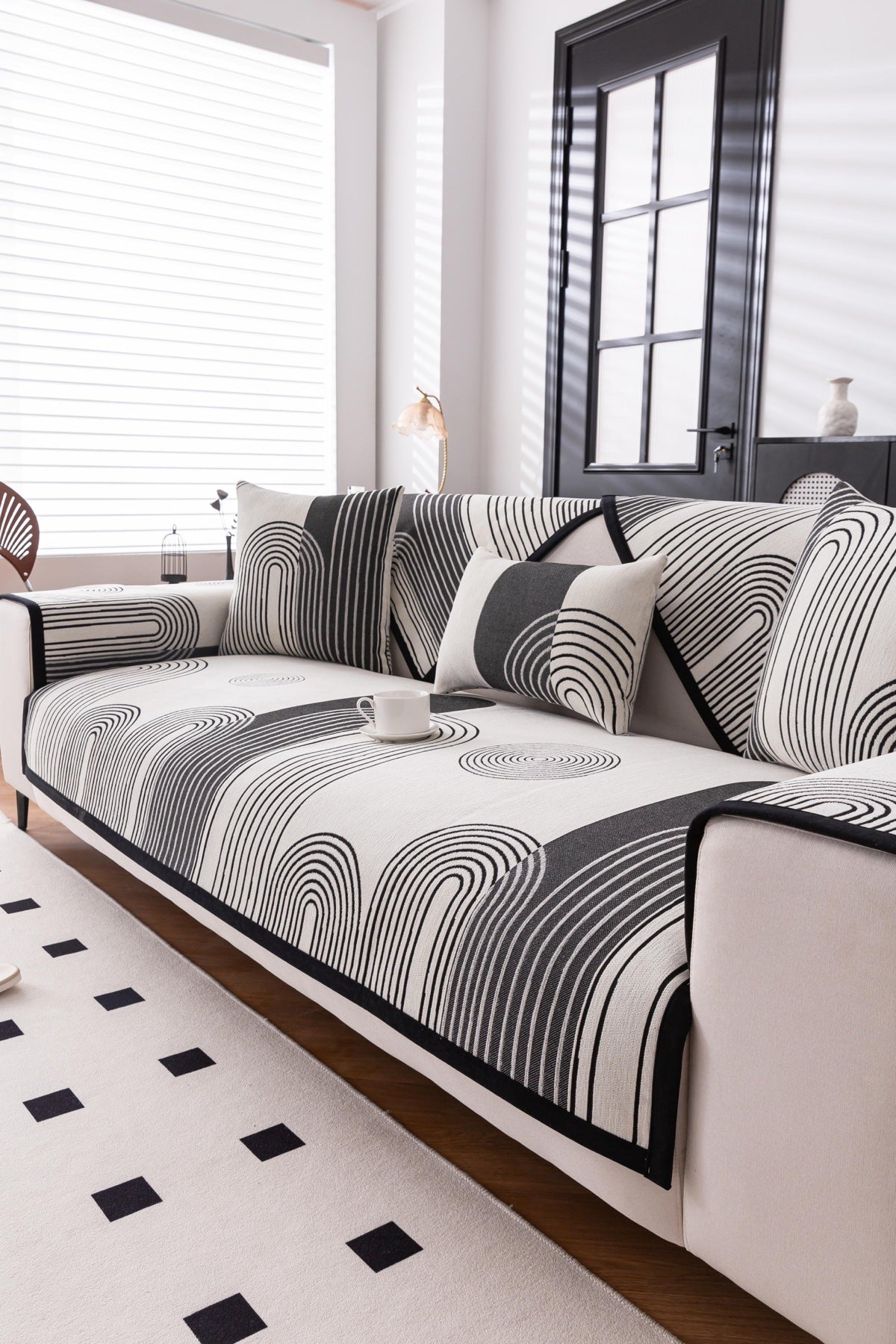 Sofa Decor Arcadia Arch Line Sofa Cover in Black Cream - styled sofa image for water resistant patterned couch covers in the UK
