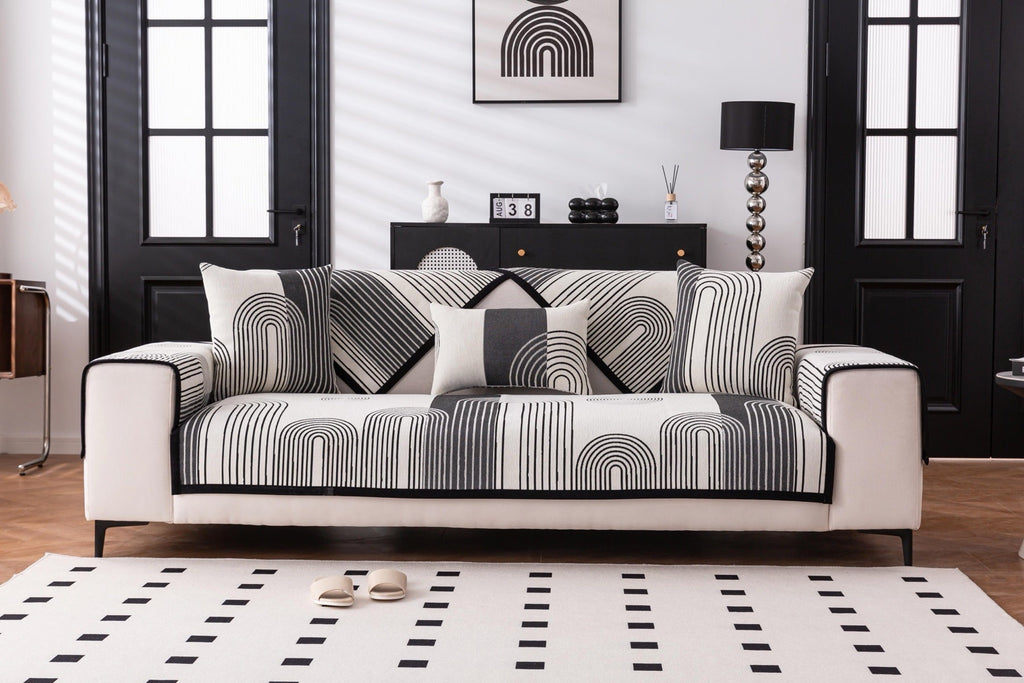 Sofa Decor Arcadia Arch Line Sofa Cover in Black Cream - styled sofa image for water resistant patterned couch covers in the UK