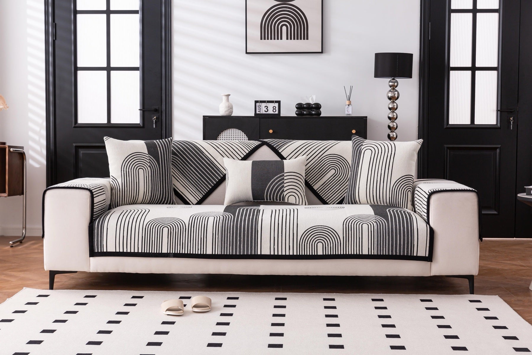 Sofa Decor Arcadia Arch Line Sofa Cover in Black Cream - styled sofa image for water resistant patterned couch covers in the UK