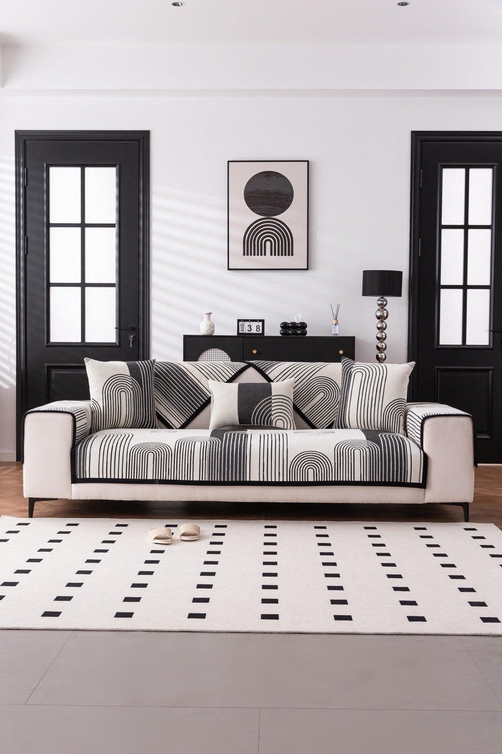 Sofa Decor Arcadia Arch Line Sofa Cover in Black Cream - styled sofa image for water resistant patterned couch covers in the UK