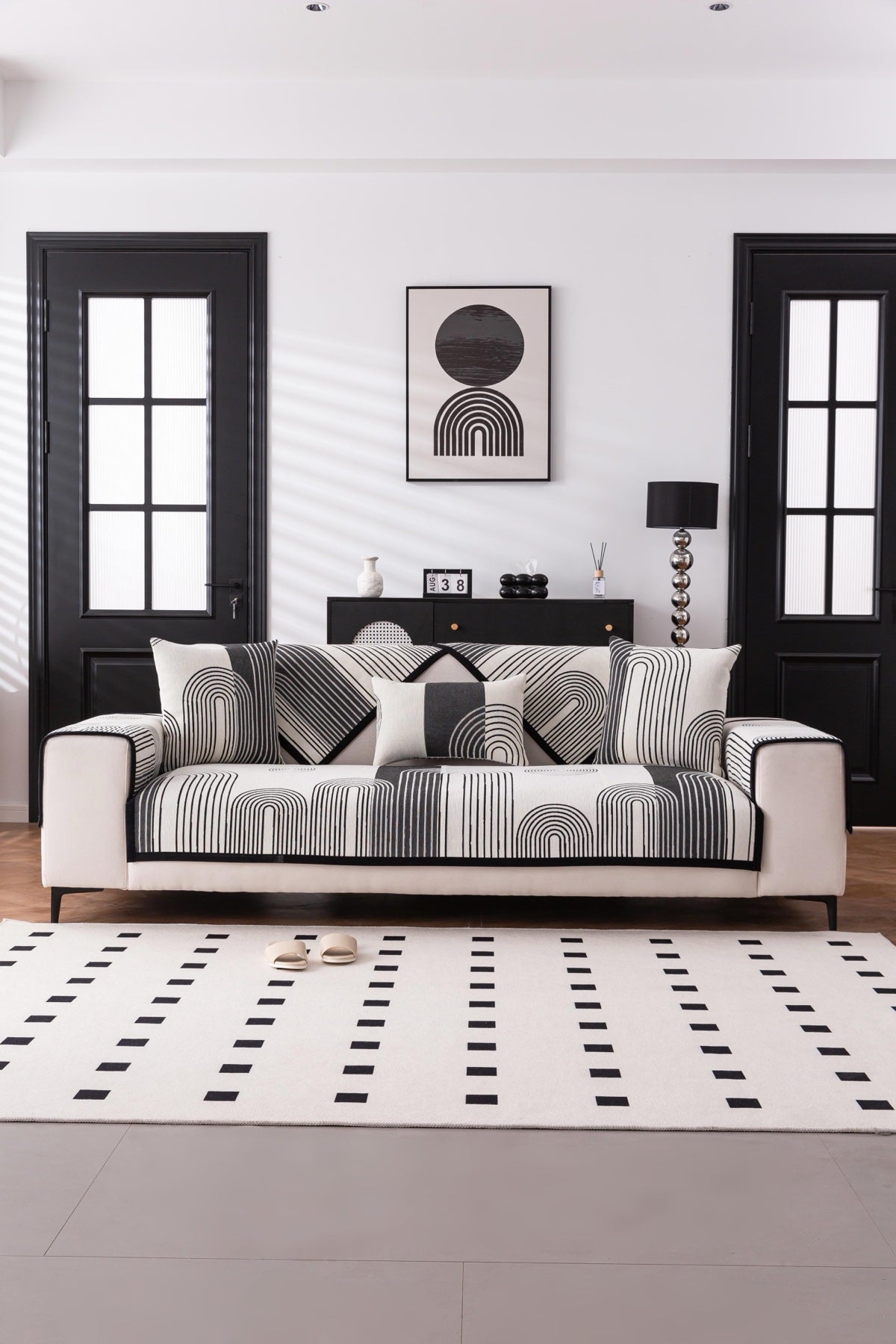 Sofa Decor Arcadia Arch Line Sofa Cover in Black Cream - styled sofa image for water resistant patterned couch covers in the UK