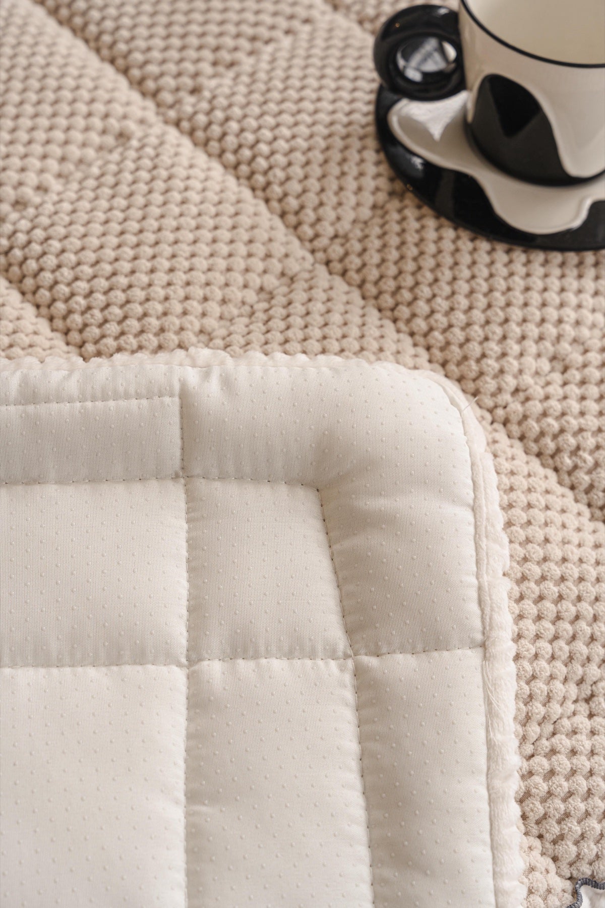 Sofa Decor Aspen Quilted Sherpa Sofa Seat Cover in Warm Taupe Sherpa - quilted fabric and sherpa edge detail for quilted sofa seat covers in the UK
