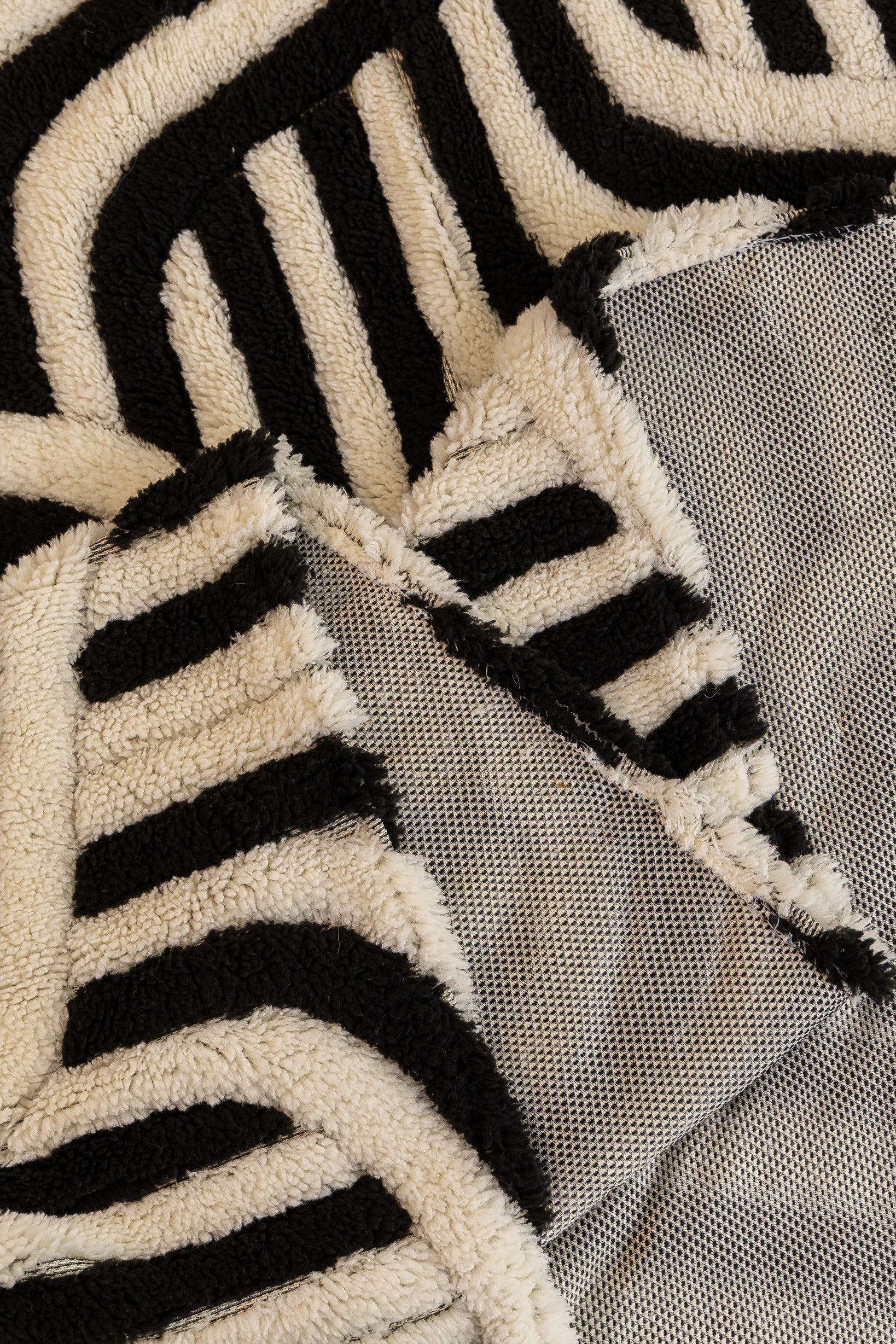 Sofa Decor Riviera Wave Stripe Sofa Cover in Black Cream - fabric detail image for plush patterned couch covers in the UK