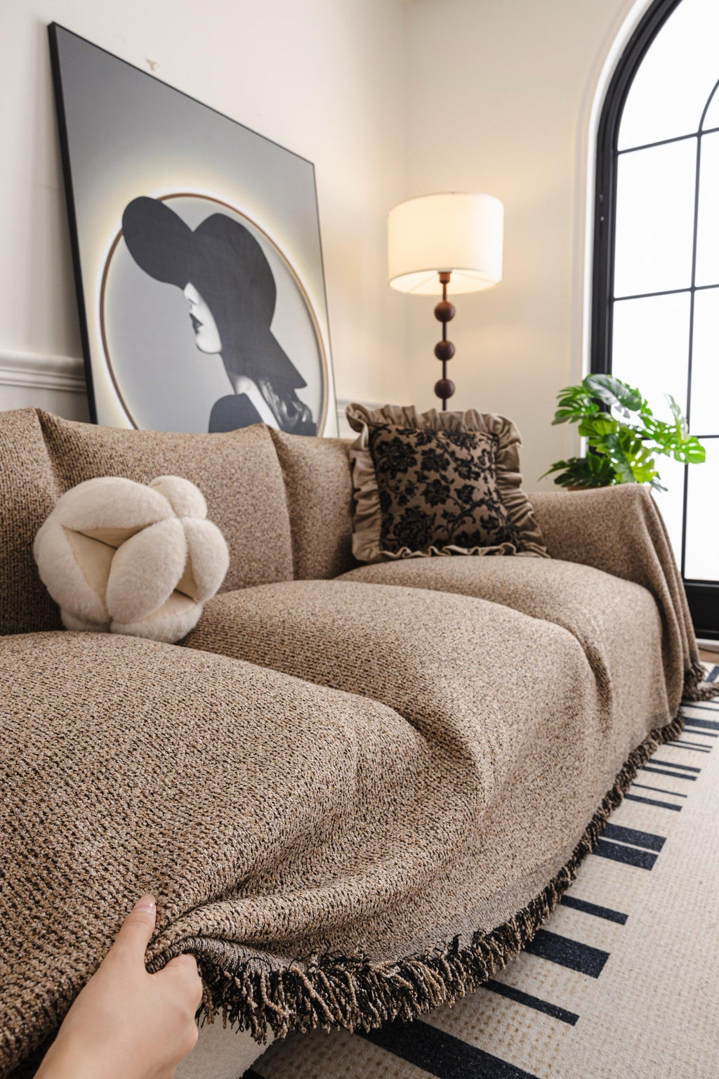 Sofa Decor Como Textured Boucle Fringe Sofa Throw Cover in Warm Taupe - textured boucle sofa throw cover hand and drape closeup in the UK, image 8