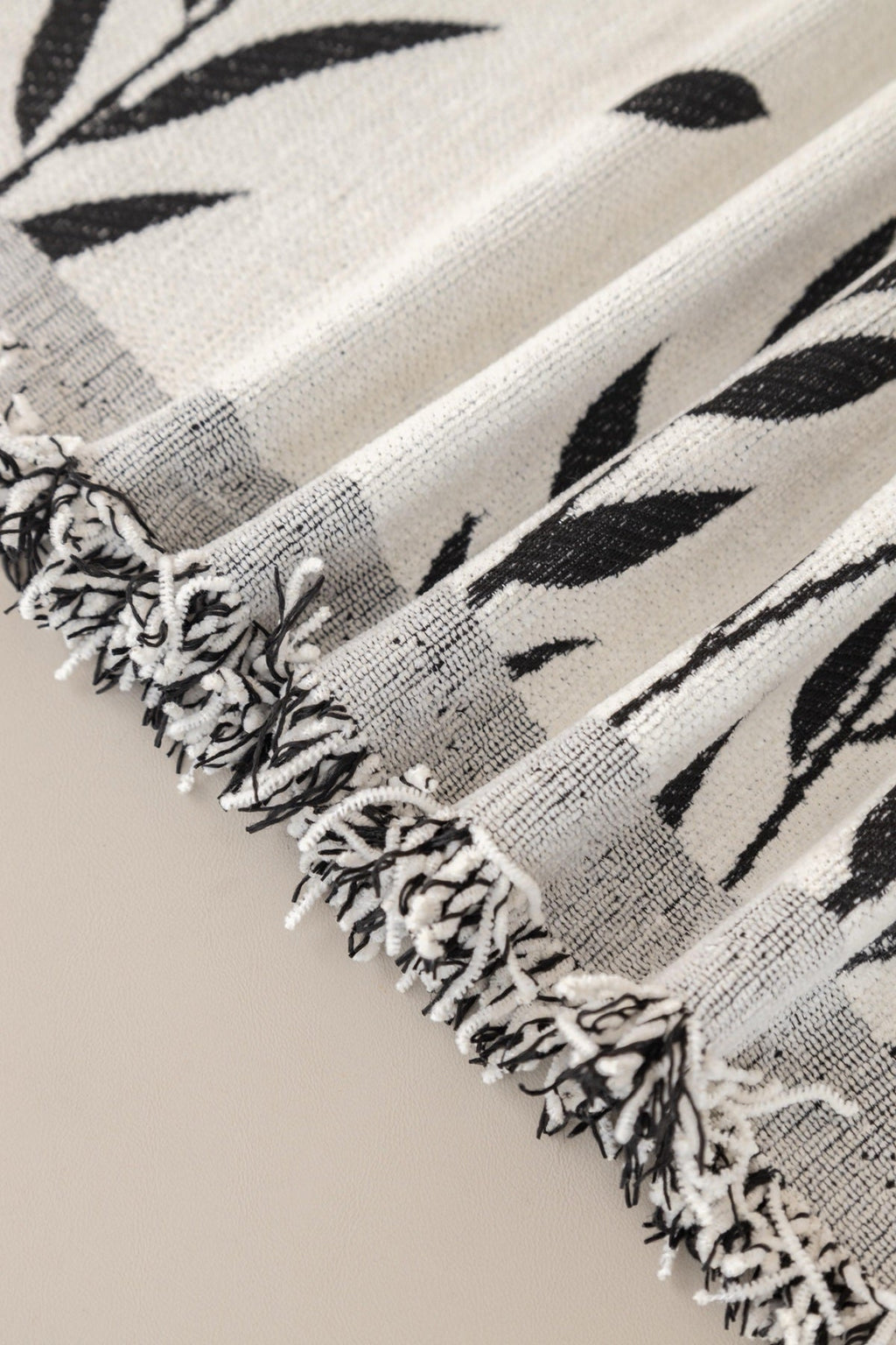 Sofa Decor Oliva Leaf Fringe Sofa Throw Cover in Black Leaf - leaf pattern sofa throw cover fabric and edge detail in the UK, image 30