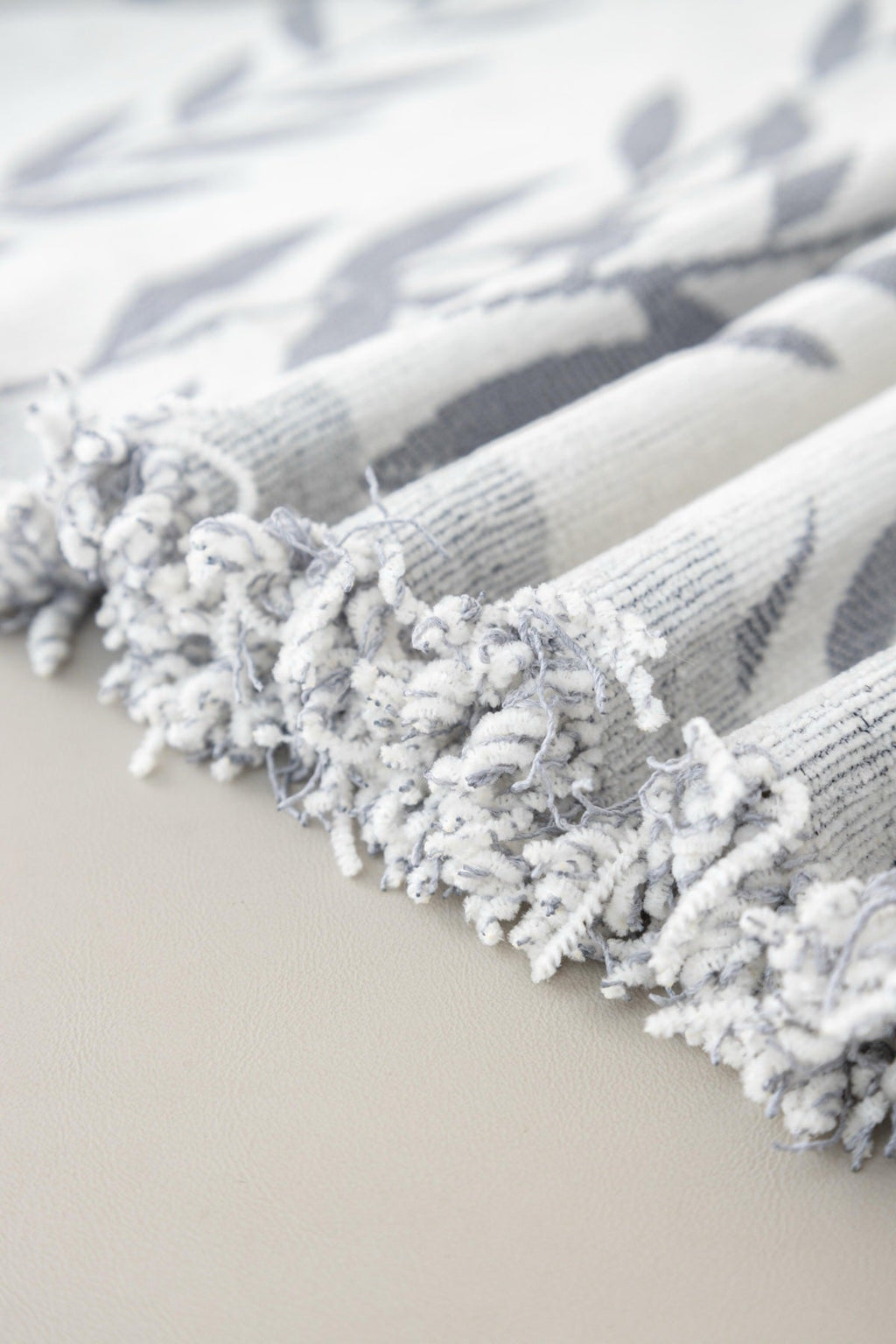 Sofa Decor Oliva Leaf Fringe Sofa Throw Cover in Silver Leaf - leaf pattern sofa throw cover fabric and edge detail in the UK, image 14