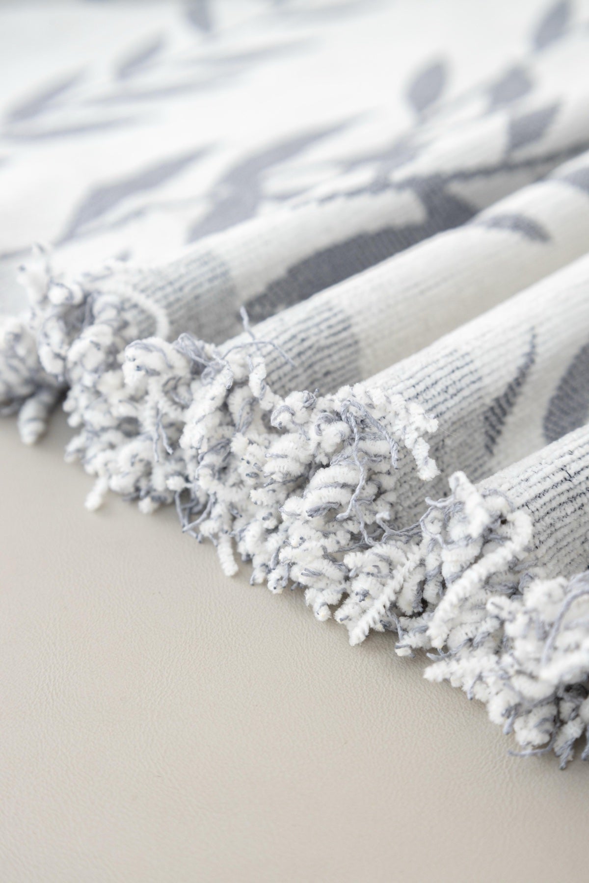 Sofa Decor Oliva Leaf Fringe Sofa Throw Cover in Silver Leaf - leaf pattern sofa throw cover fabric and edge detail in the UK, image 14